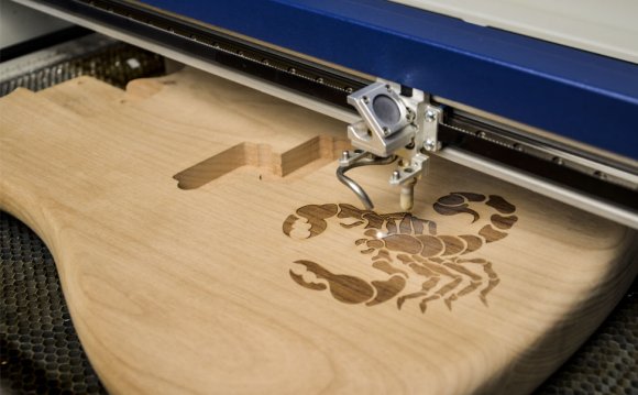 Laser engraving a wood guitar
