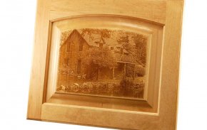 Photo engraved on a wood cabinet.