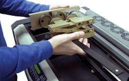 Rotary attachment being placed in the laser.